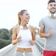 Attractive Man and Beautiful Woman Jogging Together - VideoHive Item for Sale