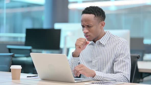 Young African Businessman with Laptop Having Cough Coughing