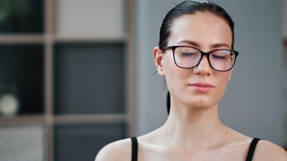 Closeup Portrait of Young Brunette Asian Female with Natural Beauty and Perfect Skin Posing at Home