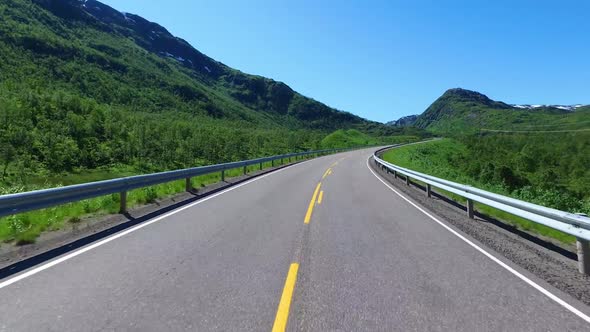 Driving a Car on a Road in Norway