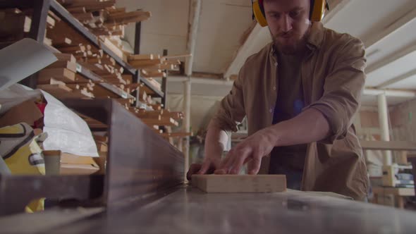 Woodworker Planing Board with Table Saw