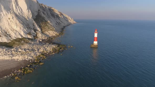 Sunset Aerial View of a Lighthouse in the Sea