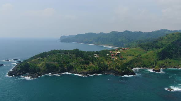 Volcanic cape at Menganti Kebumen beach at Java coast Indonesia, aerial panorama