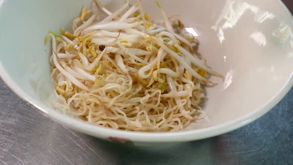 Thai Styled Tom Yum Noodles Contained With Egg Noodles, Minced Pork Cake, Pork Liver and Intestine,