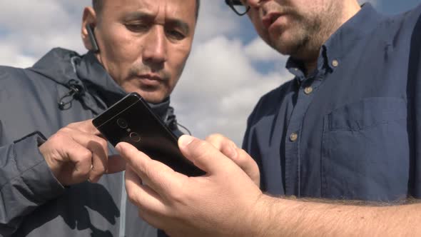 Businessman and Agronomist are Working with the Help of Agro Application on Smartphone