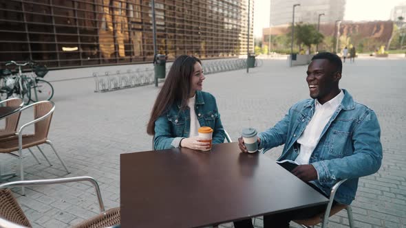 Cheerful Diverse Friends Drinking Coffee in City