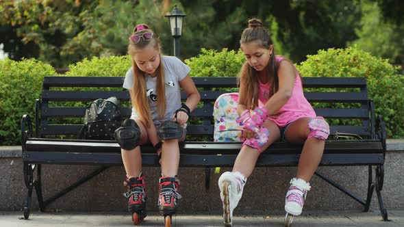 Young Teen Girls Preparing for Roller-skating