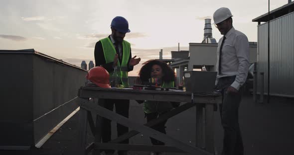 On the Rooftop of Construction Site Two Architects