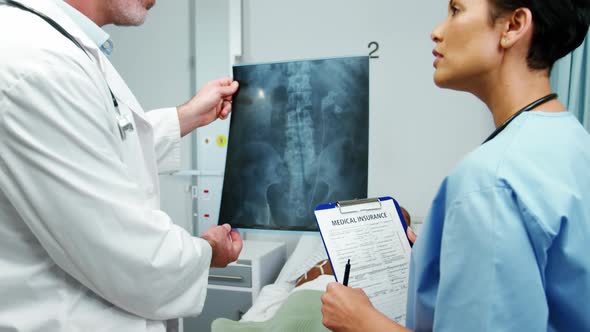 Doctor and nurse studying a x-ray