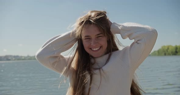 Portrait of Young Attractive Female Who Smiling and Looking at the Camera. Cheerfully Pretty Woman