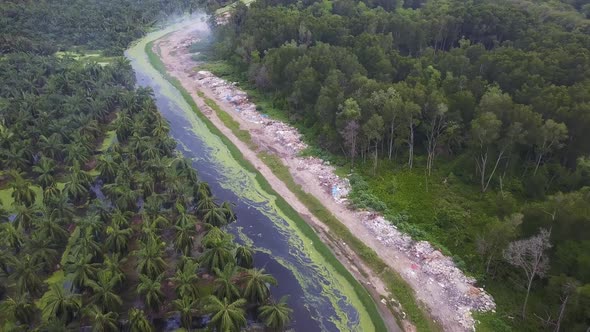 Aerial view rubbish dump neat the black river bank