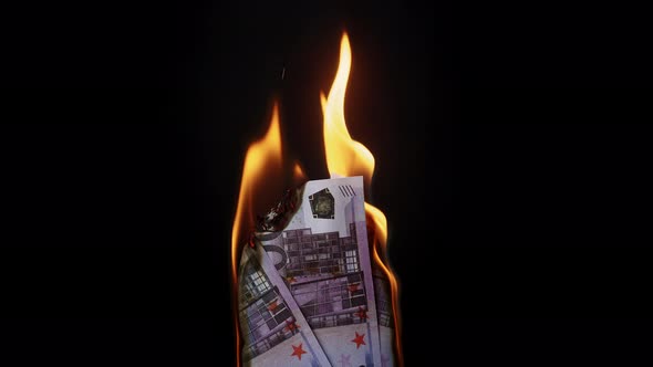 Burning of 500 Euro Banknotes on Black Background