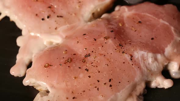 Grilling pork chop slices