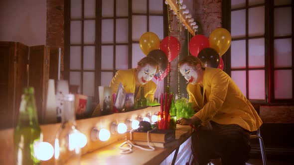 A Tired Crying Man Clown Smoking in the Dressing Room - Rip Off His Bowtie