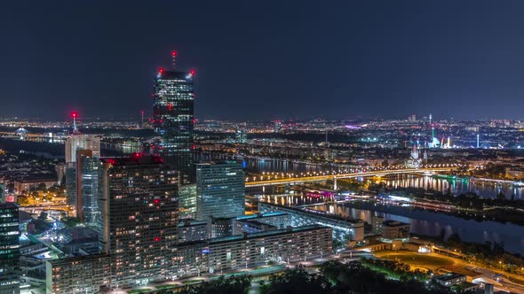 Aerial Panoramic View Over Vienna City with Skyscrapers Historic Buildings and a Riverside Promenade