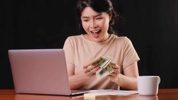 Asian woman paying her bills