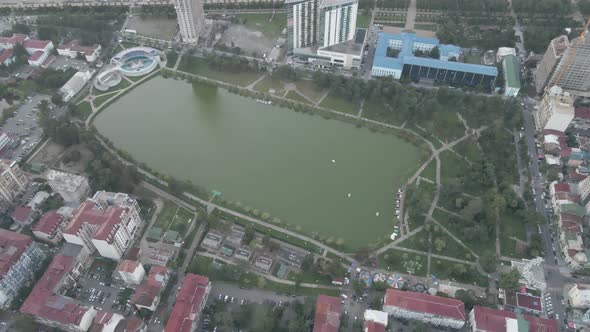 Top aerial view of beautiful lake in the center of Batumi. flying over 6 May park. Georgia