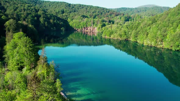 Aerial view of Plitvice lakes croatia, with waterfall pristine water lake formation and mountains gr