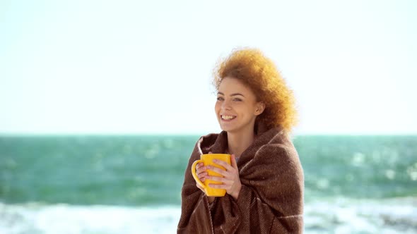 Beautiful Redhead Girl Walking Near the Sea