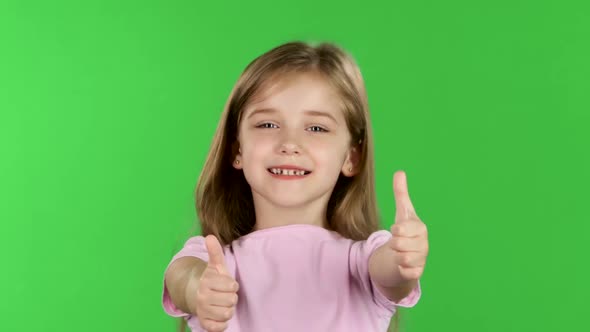 Child Girl Showing Thumbs Up. Green Screen