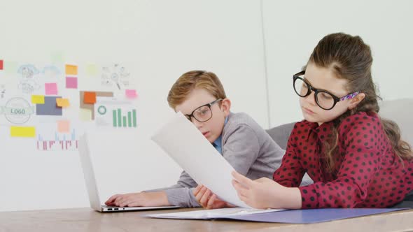 Kids as business executive working at desk 4k