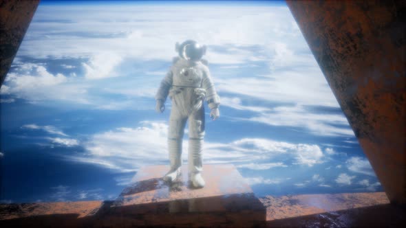 Astronaut on the Space Observatory Station Near Earth alt