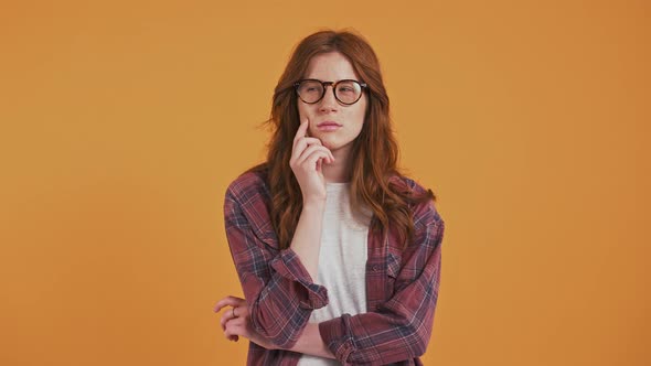 Ginger Teenage Female in Checkered Shirt and Glasses