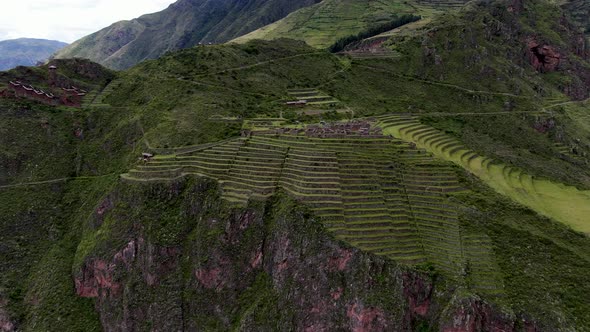 Towering Mountains With Farm Terraces In Pisac Ruins, Sacred Valley Of The Incas In Peru. Aerial Dro