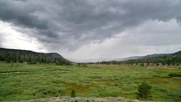 Timelapse of rainstorm moving over meadow in the Utah wilderness