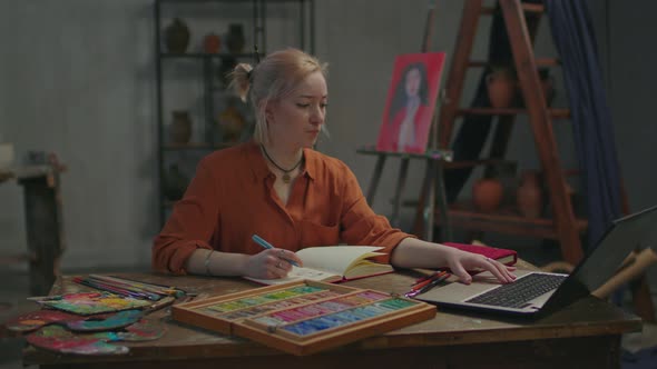 Inspired Woman Learning Art Course Online Using Laptop