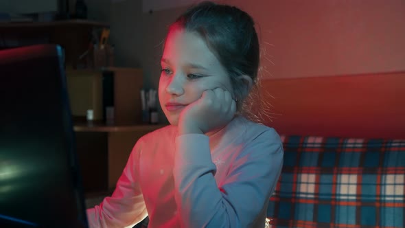 Little Girl Misses Sitting at the Computer