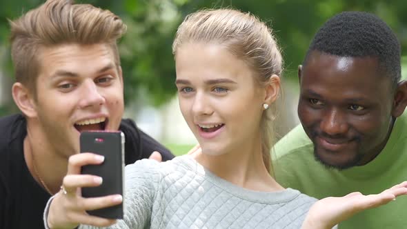 Friends Taking a Selfie on a Blue Sky in Campus Lawn, African Man. Slow Motion. Close Up