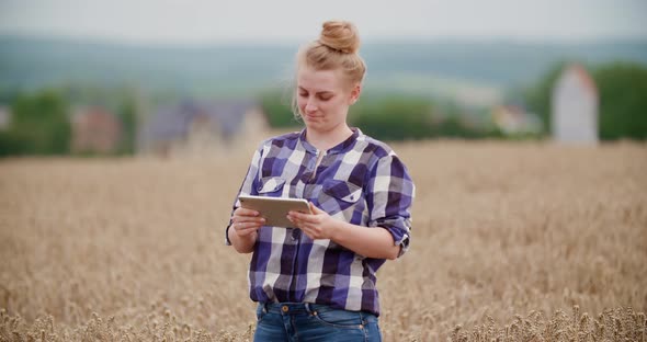 Portrait of Female Farmer with Digital Tablet at Farm