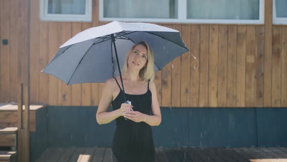 Attractive Blonde in the Summer Rain