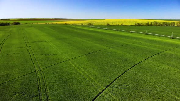 Aerial, Flight Above Rural Countryside Landscape With Irrigation sistem