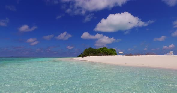 Luxury above tourism shot of a summer white paradise sand beach and aqua blue water background in be