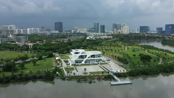 panning drone shot of ultra modern residential and commercial lakeside development area with green s
