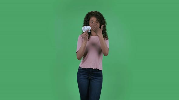 Portrait of Beautiful African American Young Woman Is Looking at Camera and Cries with Happiness and