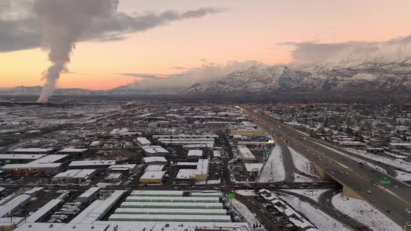 Aerial view of traffic on freeway through industrial area in Utah