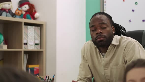 Surprised African American Teacher During a Lesson at School