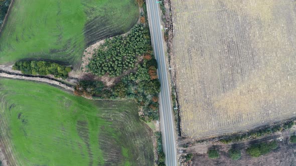Road between fields viewed from the sky