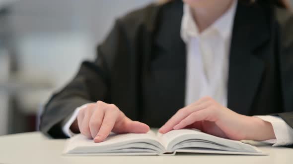 Close Up Woman Reading Book in Cafe