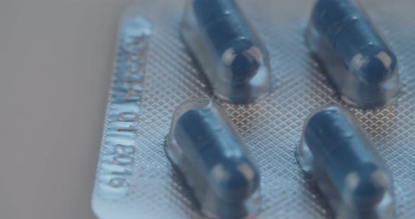 Prescription drugs - Capsules, pills, tablets on reflective background