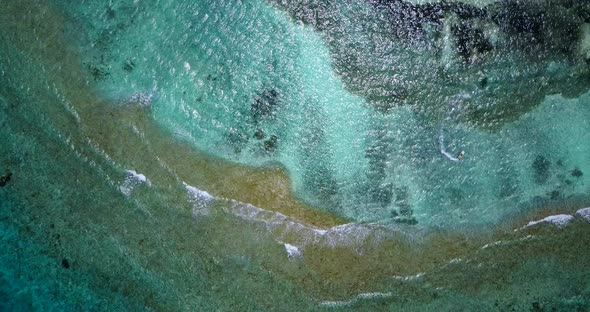 Natural fly over abstract shot of a white sand paradise beach and aqua turquoise water background in