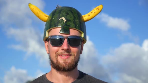 Closeup Portrait Of Smiling Man in Viking Fruit Helmet