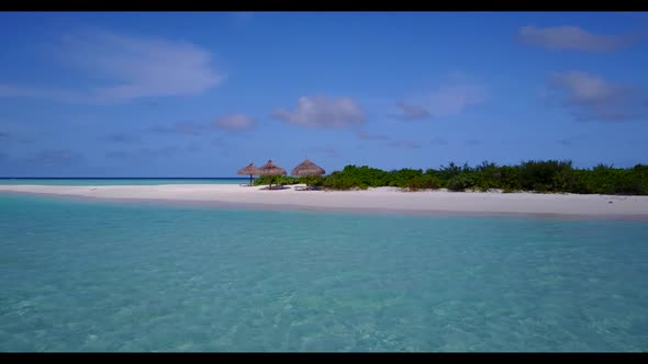 Aerial above seascape of idyllic bay beach lifestyle by transparent water with white sand background