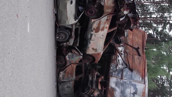 Vertical Video of a Dump of Cars Destroyed By the War in Ukraine