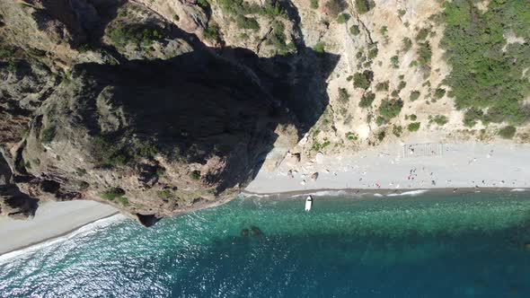 Aerial View From Above on Azure Sea and Volcanic Rocky Shores