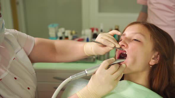 Girl in the Dental Cabinet Sitting in Armchair