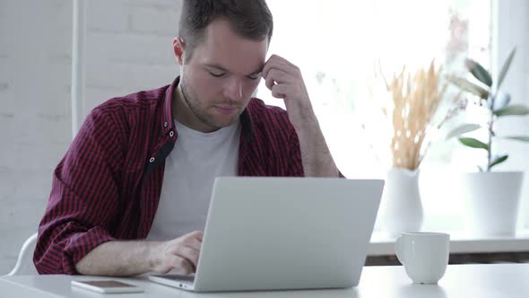 Headache Upset Tense Young Young Man Working in Office